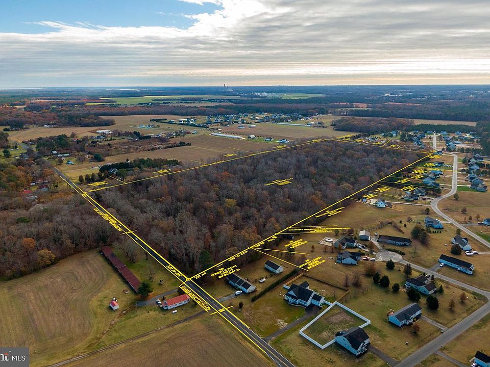 Aerial of Morris Mill Rd with the 48-acre parcel boundary overlaid in yellow surveyor lines, showing the full perimeter and approximate dimensions against the surrounding farms and homes