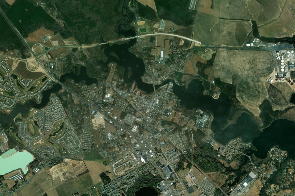 Aerial satellite context showing Morris Mill Rd parcel within Sussex County woodland and farmland, Millsboro DE.